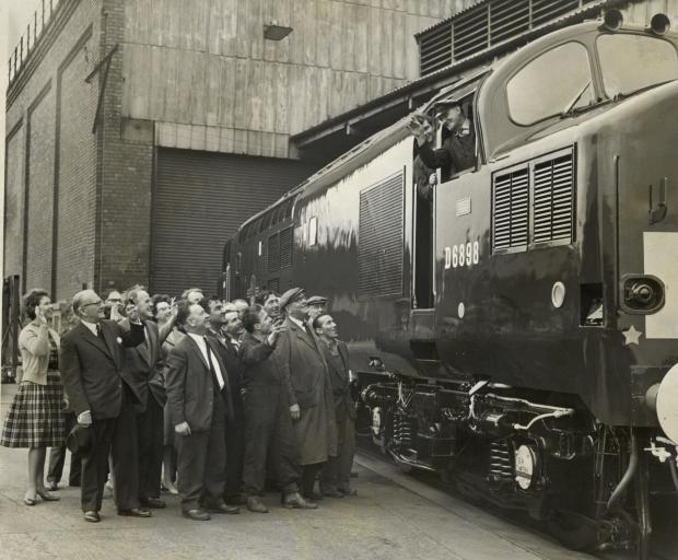 The Northern Echo: Closure of Robert Stephenson and Hawthorne / Stivvies closure in 1964, Darlington. Worker gather to see the final diesel locomotive as it leaves the Darlington works