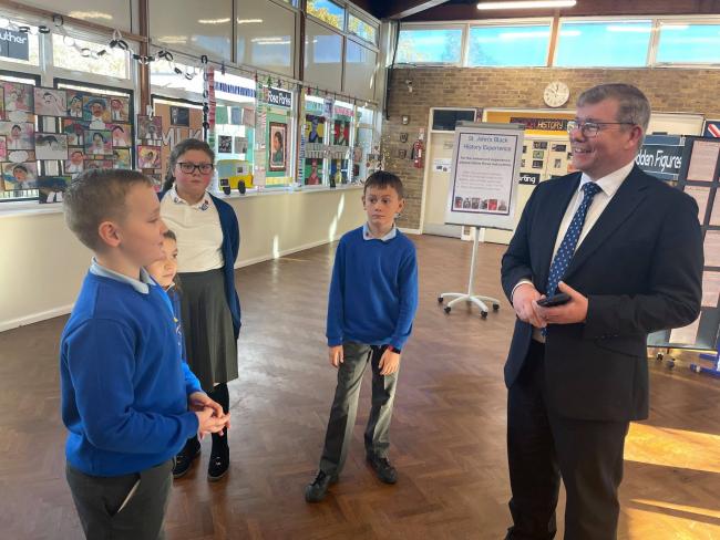 Peter Gibson MP chatting with pupils from St John's Church of England Academy in Darlington about their exhibition on Black History Month