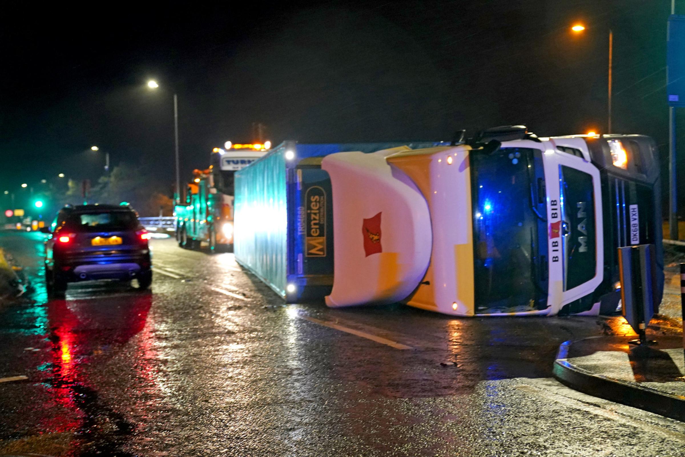 A lorry blown over in high winds blocks the A179 near Hartlepool, County Durham, after gusts of almost 100 miles per hour battered some areas of the UK during Storm Arwen. Picture date: Saturday November 27, 2021. PA Photo. The Met Office issued a rare