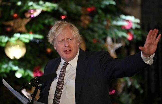 Boris Johnson shows no signs of cancelling Christmas. Photo credit should read: Justin Tallis/PA Wire.