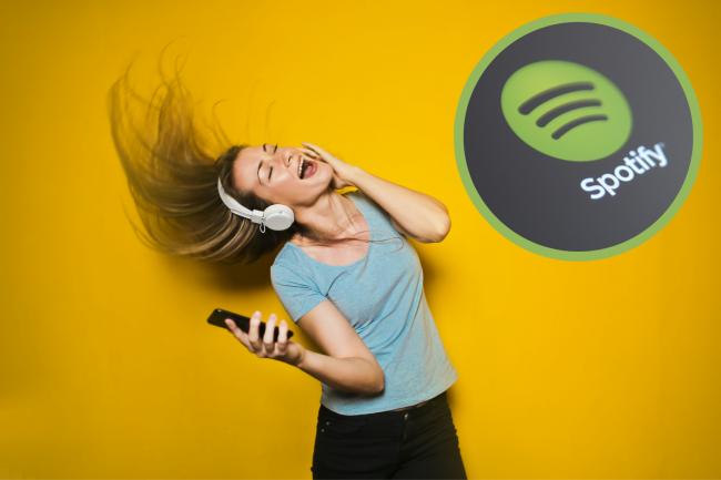A woman singing to your music listening to headphones. ( Canva) Spotify logo. (PA)