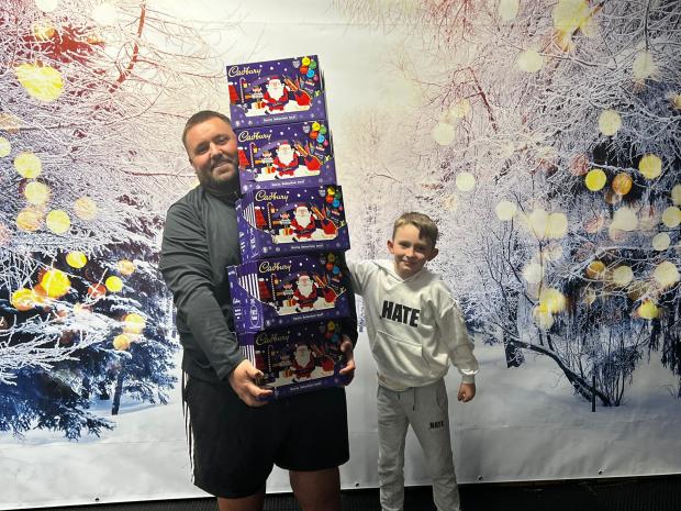 The Northern Echo: Mike's client Rob Busby, and Mike's son Max with a donation of selection boxes
