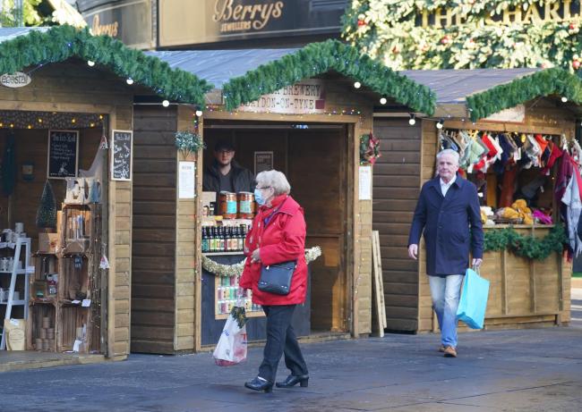 Shoppers walk through the near empty Christmas Market in Newcastle city centre. Customers have been staying at home in the crucial run-up to Christmas as consumer confidence has been knocked by new coronavirus restrictions and increasing health warnings.