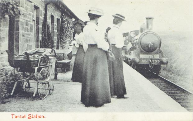 The Northern Echo: Ladies in Edwardian finery wait at Tarset station, near Kielder forest and reservoir, for the train from Hexham to take them on the Border Counties Railway towards Reedsmouth