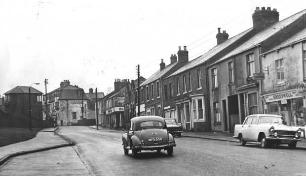 The Northern Echo: Looking north up Salters Lane with the landmark Dovecote Hotel at the top of the street on November 30, 1970. It looks as the level crossing gates just in front of the Dovecote still exists. This was the Ferryhill & Hartlepool branch which ran into