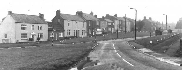 The Northern Echo: Trimdon Village in November 1964, with the venerable St Mary Magdalene church on the right and the Black Bull on the left, serving Nimmo's ales. Next to it is E Ryder's newsagent, proudly advertising The Northern Echo. It is now a