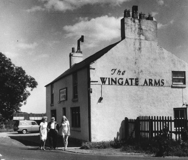 The Northern Echo: This old gentleman looks as if he cannot believe his luck as two young ladies lead him away from the Wingate Arms, Trimdon Grange, in August 1970. The Echo's photographer has parked his van to provide a backdrop to the picture. The Wingate Arms was