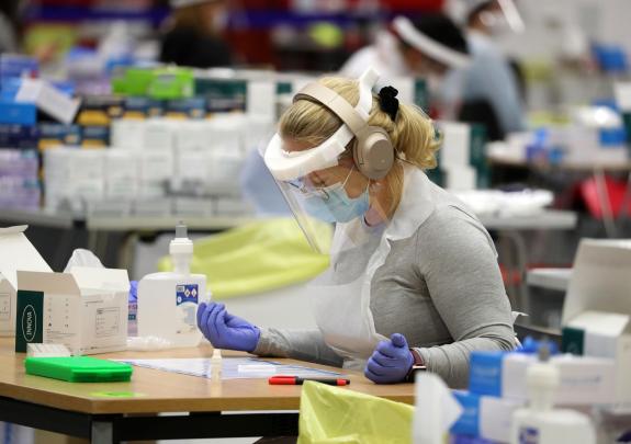 The Northern Echo: An essential worker at a Covid testing centre. Credit: PA The Northern Echo: An essential worker at a Covid testing centre. Credit: PA