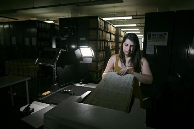 The Northern Echo: Photo via PA shows Findmypast technician Laura Gowing scans individual pages of the 30,000 volumes of the 1921 Census at the Office for National Statistics (ONS) near Southampton.