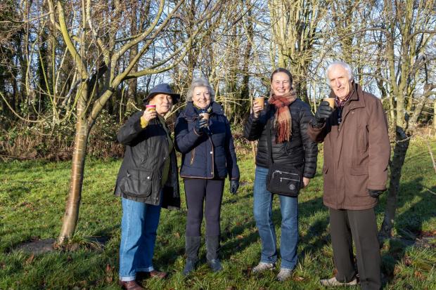 EPICH volunteers prepare the orchard ahead of the wassail: (from left) Pat Simpson, Judith Redfern, Lynn Wylie, Ken Pattison