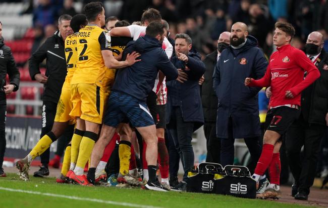 Sunderland manager Lee Johnson is involved in a touchline altercation during last night's game against Lincoln City. PICTURE: PA.