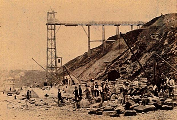 The Northern Echo: Peter Sotheran's picture of Saltburn from 1880 showing the vertical hoist that was built to drop the stone railway sleepers to the promenade. Holidaymakers were also able to use it, although it had the worrying habit of getting jammed halfway