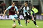 Chris Wood battles Newcastle's Javier Manquillo for the ball. PICTURE: PA.