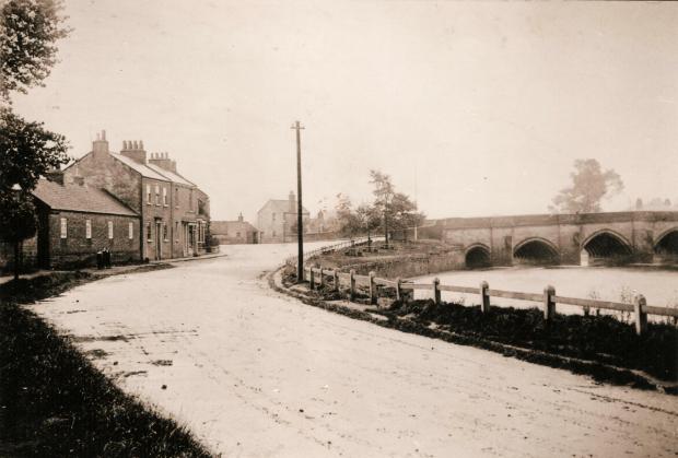 The Northern Echo: Looking towards Croft bridge with the Comet hotel on the left hand side of the road and the outline of the Pig and Whistle in the centre behind the pole