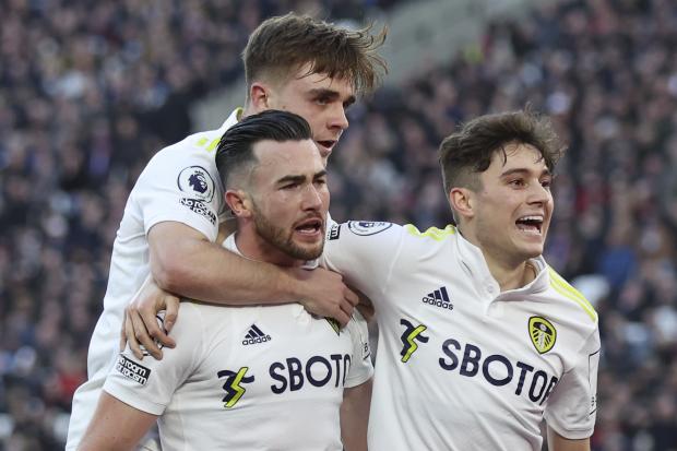 The Northern Echo: Leeds United's Jack Harrison, bottom left, celebrates after scoring his side's third goal during the English Premier League soccer match between West Ham and Leeds United in London, Sunday, Jan. 16, 2022. (AP Photo/Ian Walton).