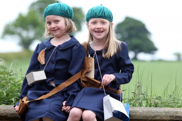 The Northern Echo: Baldersby St James Primary School, nr Thirsk - 1940's event at the school. Pictured (L-R) are pupils Romilly Scales (6) and Lottie Wright (7) dressed in clothing to represent the era. 11/06/2013