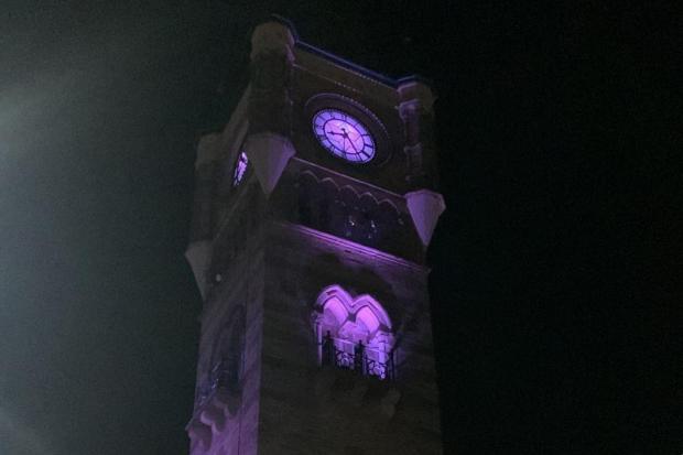 The Northern Echo: Darlington Clocktower was lit up in purple last night to mark the memorial day. Picture: DARLINGTON BOROUGH COUNCIL.