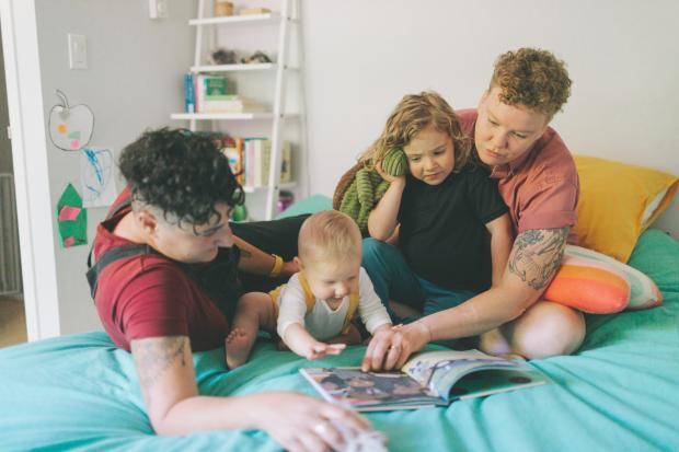 The Northern Echo: A family reading a book together. Credit: Canva