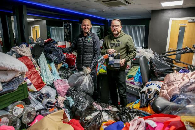 The Northern Echo: Thousands of donations for Ukraine are being dropped off at Firth Moor community centre pictured Cllr Darrien Wright and Chairman of the centre Steven Tait. Picture: SARAH CALDECOTT