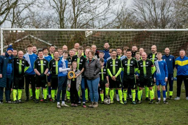 The Northern Echo: Players from Cobblers Hall over 40s join Newton Aycliffe U15s and Darren's wife Donna, and three children Declan, Noah and Layna. Picture: SARAH CALDECOTT.