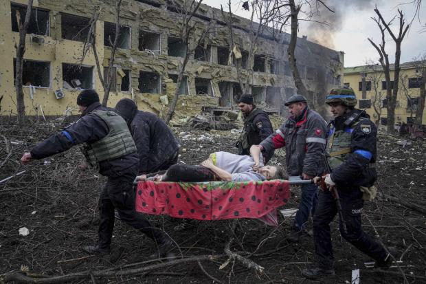 The Northern Echo: Ukrainian emergency employees and volunteers carry an injured pregnant woman from a maternity hospital that was damaged by shelling in Mariupol, Ukraine, March 9, 2022. The woman and her baby died after Russia bombed the maternity hospital where she was