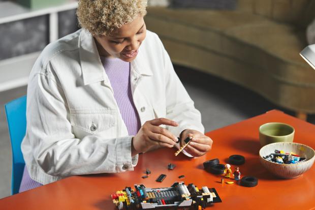 The Northern Echo: A woman putting together the LEGO Delorean. Credit: LEGO
