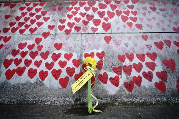 Flowers by the The National Covid Memorial Wall in London, on the second National Day of Reflection, to remember those who died during the Covid pandemic. Picture: YUI MOK/PA