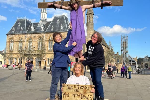 The Northern Echo: Jesus (Paul Taphouse) rehearses the crucifixion in Bishop Auckland Market Place with Rev Canon Eileen Harrop (L), Performance Director Sam Bradshaw (C) and Rachael Masters (R).