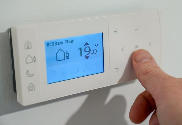 The Northern Echo: Niraz Buhari says for every degree you turn down your thermostat you can save an estimated 10 per cent of energy. Picture: PA