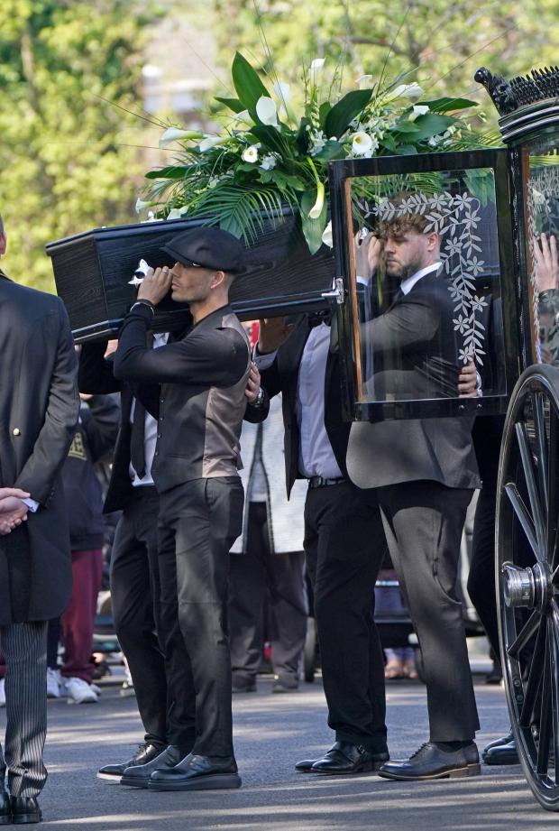 The Northern Echo: Max George and Jay McGuiness of The Wanted carry the coffin at the funeral of their bandmate. (PA)