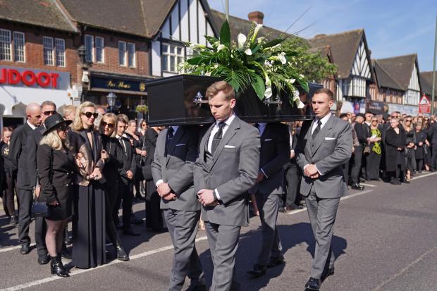 The Northern Echo: The coffin of The Wanted star Tom Parker is carried ahead of his funeral. (PA)