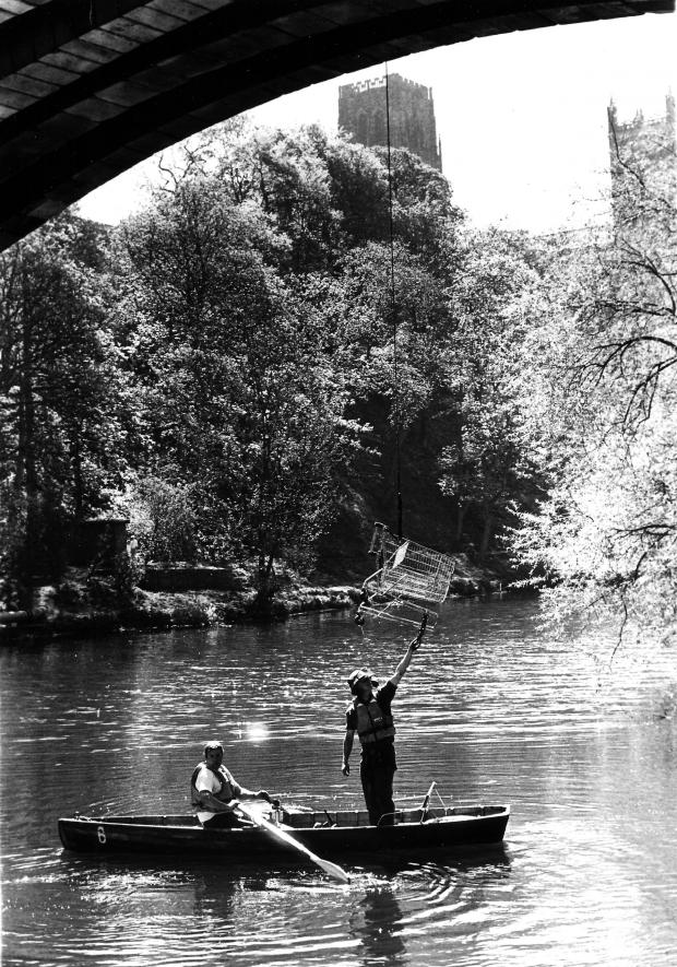 The Northern Echo: A clean up of the Wear in Durham in May 1990 with a shopping trolley being winched onto the bridge above