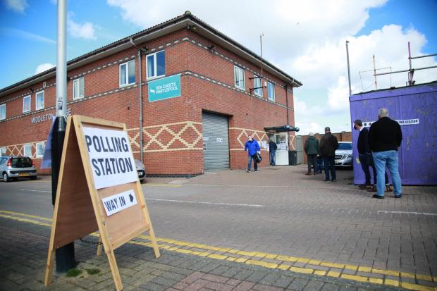 The Northern Echo: Voters queue at a polling station in the Headland area of Hartlepool in May 2021. Picture: SARAH CALDECOTT