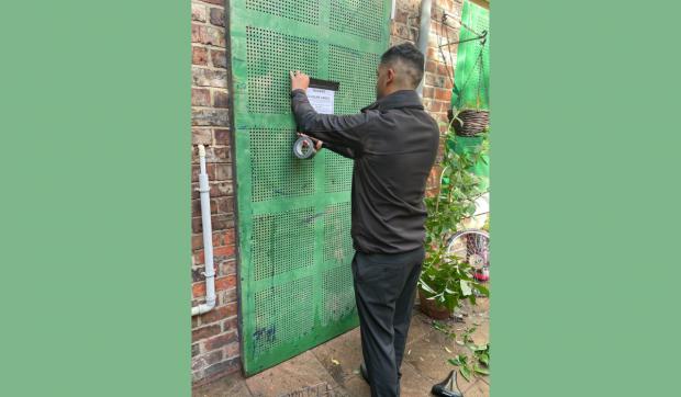 The Northern Echo: Some of the drug dealing activity is said to have involved items being passed through a letterbox-sized slot cut into a boarded-up window.  Picture: STOCKTON BOROUGH COUNCIL