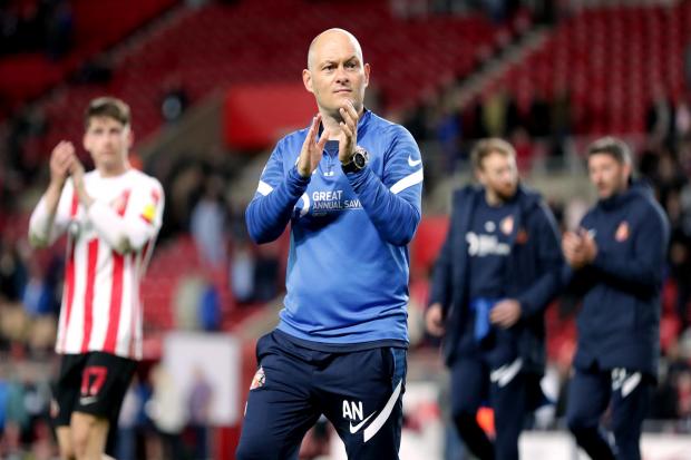 Sunderland manager Alex Neil applauds the fans after the Sky Bet League One play-off semi-final, first leg match at the Stadium of Light, Sunderland. Picture date: Friday May 6, 2022.