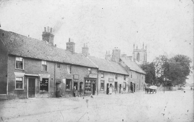 The Northern Echo: The east end of Hurworth: the two buildings on the right have been demolished to enlarge the churchyard. The building in the centre with the large shop window is now the fish and chip shop on the end of the row