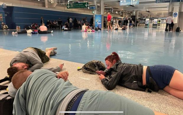 The Northern Echo: Passengers were forced to lie down in the 'holding' area in Porto Airport. Picture: AARON SCOTT.