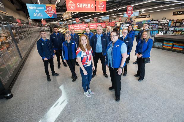 The Northern Echo: The new staff at the Aldi store with Team GB hockey hero Sarah Jones. Picture: ALDI.