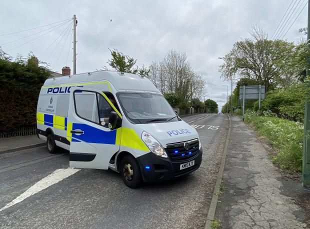 The Northern Echo: Police vehicles block the B6309 road in Medomsley, County Durham, in both directions today (May 19) following a suspected firearms incident Pictures: NORTH NEWS.