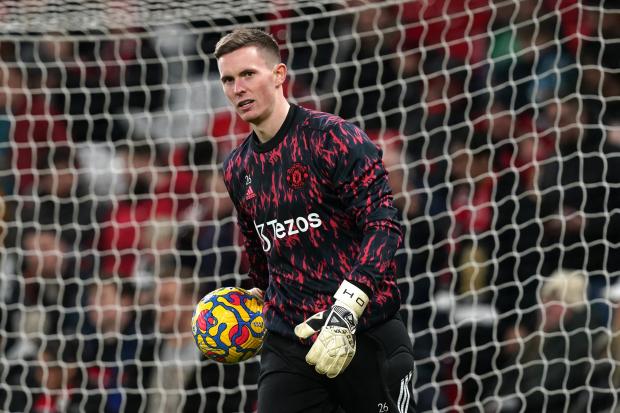 Manchester United goalkeeper Dean Henderson warming up before the Premier League match at Old Trafford, Manchester. Picture date: Tuesday February 15, 2022..