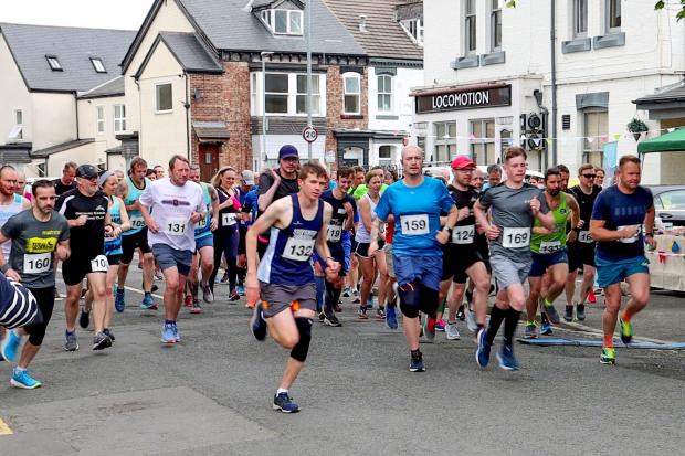 Runners cross the start line of the Locomotion Run . Pictures: Chris Barron