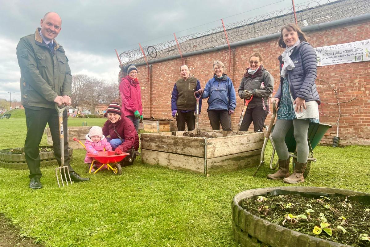 David Smith, left,  and Helen Ball, right, Broadacres’ Sustainability Manager, with volunteers at the Applegarth Community Garden