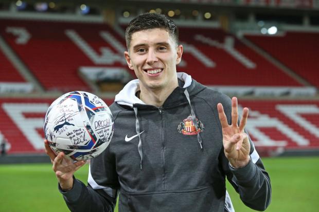 The Northern Echo: SUNDERLAND, ENGLAND - DECEMBER 30: Ross Stewart of Sunderland holds his signed match ball after scoring a hat trick to take him to top scorer in League One during the Sky Bet League One match between Sunderland and Sheffield Wednesday at Stadium of Light