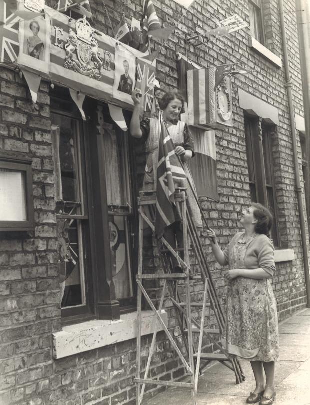 The Northern Echo: THIS brilliant picture shows the decorations going up in Forster Street, Darlington, for the 1953 coronation of Queen Elizabeth. The picture features in the exhibition that is on until the bank holiday in Darlington library of local programmes,