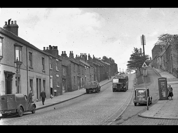 The Northern Echo: Looking up Gilesgate bank around 1946. The properties on the left (up to just past the wagon) were demolished in the 1960s for the new road scheme. The property set back a little near the wagon was Forman’s fish and chip shop. The vehicles, left to