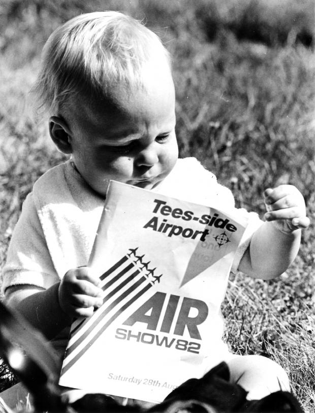 The Northern Echo: Young Martin Sanderson of Guisborough enjoys flicking through the programme for the 1982 air show that was held at "Tees-side Airport"