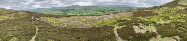 The Northern Echo: The Iron Age fort of Maiden Castle in Swaledale is the light patch of ground in the centre of this picture. It is surrounded by deep trenches