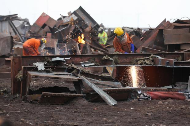 The Northern Echo: Workers cutting scrap metal from Sinter Plant 