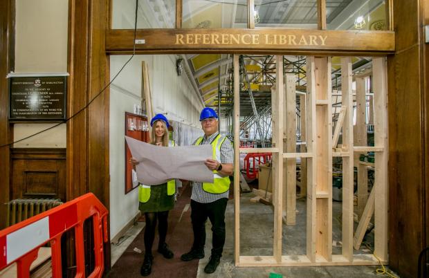The Northern Echo: Darlington Library Manager Suzy Hill and Cllr Andy Keir inside the renovation of Darlington Library Picture: SARAH CALDECOTT