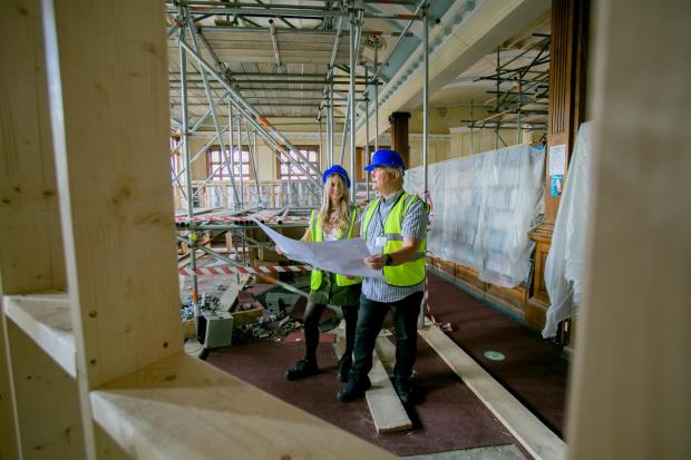 The Northern Echo: Darlington Library Manager Suzy Hill and Cllr Andy Keir inside the renovation of Darlington Library Picture: SARAH CALDECOTT